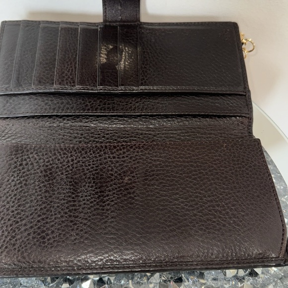 Gucci Chocolate Brown Long Wallet has its crossbody chain attached. - Picture 5 of 10